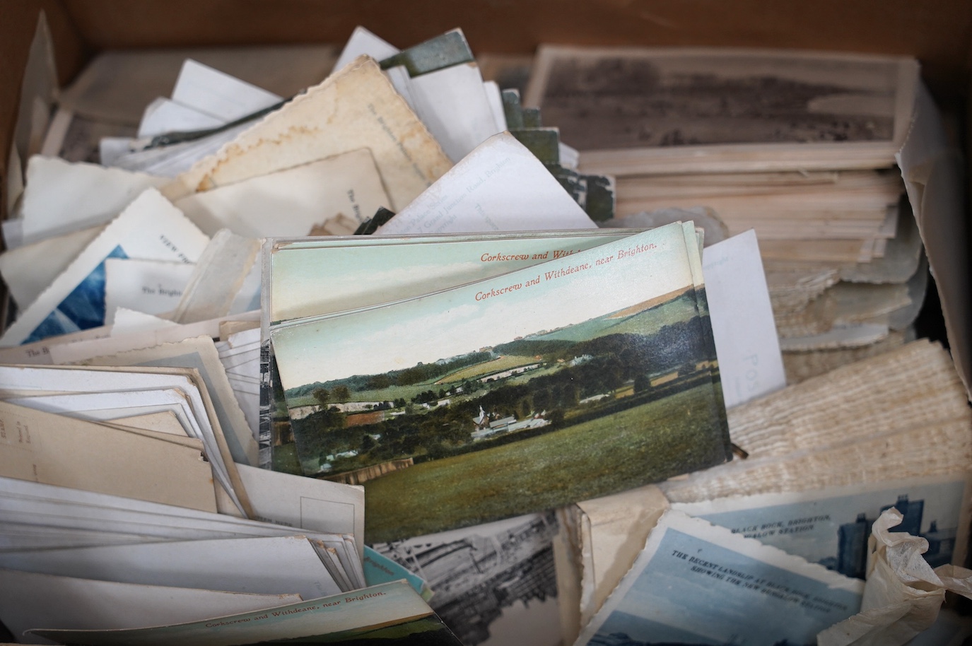 A large quantity of Brighton and Hove, and surrounding area postcards, many duplicates. Condition - fair
